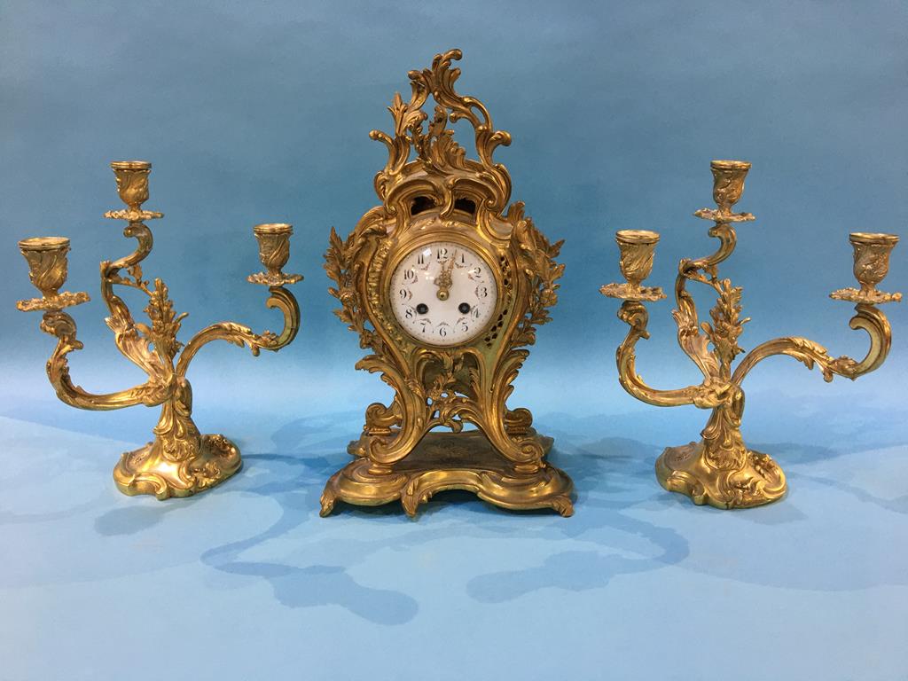 A reproduction brass Art Nouveau style clock and garniture, 43cm high x 24cm wide (approx.)