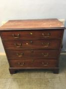 A Georgian mahogany straight front chest of drawers with four long graduating drawers, all with