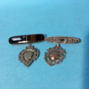 Two silver fobs and two brooches