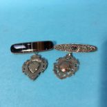 Two silver fobs and two brooches