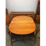 A Youngers teak sideboard, 167cm length and a teak drop flap table and four chairs