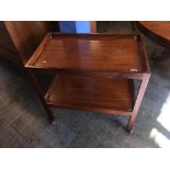 A two tier teak tea trolley