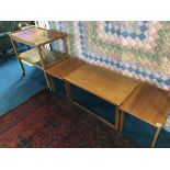 A teak tea trolley and three teak tables