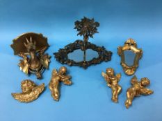 Various gilt cherubs and a gilt wood mirror etc.