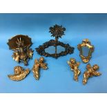 Various gilt cherubs and a gilt wood mirror etc.