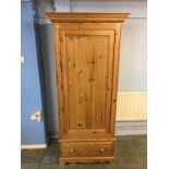 A pine single door wardrobe, 88cm wide, 60cm deep