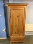 A pine single door wardrobe, 88cm wide, 60cm deep