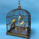 A Genykage bird cage with porcelain feeders