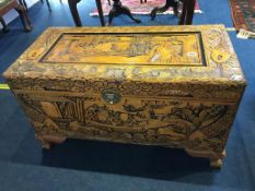 A small carved Oriental chest, 89cm length