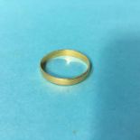 An unmarked yellow metal ring