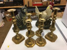 Two doorstops and three pairs of candlesticks