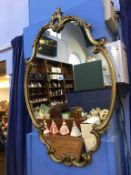 A gilt framed mirror