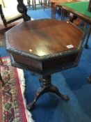 A mahogany octagonal work box