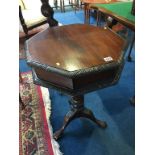 A mahogany octagonal work box