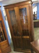 A pine two door cabinet, 96cm wide