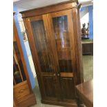 A pine two door cabinet, 96cm wide