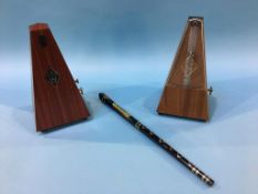 Two metronomes and a tin whistle