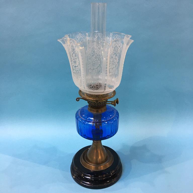 An oil lamp with blue glaze reservoir