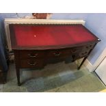 An Edwardian mahogany ladies writing desk, with inset leather top, bow front below five drawers,