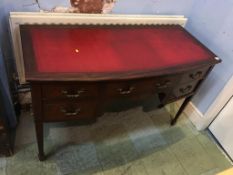 An Edwardian mahogany ladies writing desk, with inset leather top, bow front below five drawers,