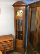 An Art Deco style walnut cased clock, with strike action