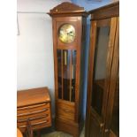 An Art Deco style walnut cased clock, with strike action