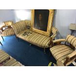 An Edwardian inlaid rosewood Salon suite comprising: settee, pair of tub armchairs and six single