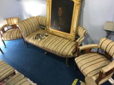 An Edwardian inlaid rosewood Salon suite comprising: settee, pair of tub armchairs and six single