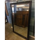 A large black framed mirror, 166 x 106cm