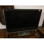 A Toshiba TV, with remote