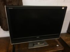 A Toshiba TV, with remote