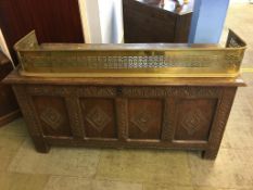 A carved oak coffer with four lozenge carved panels to the front, 131cm length