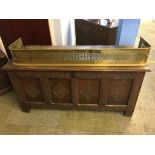 A carved oak coffer with four lozenge carved panels to the front, 131cm length