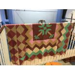 A Durham quilt in green, beige and maroon