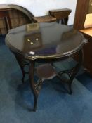 An Edwardian mahogany occasional table