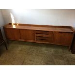 A teak sideboard, 243cm long