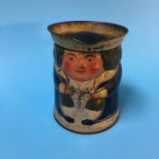 A Huntley and Palmer Toby jug biscuit tin