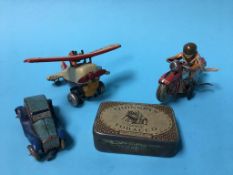 A collection of tin plate clockwork toys