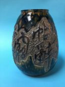 A glazed Oriental vase decorated with impressed lettering