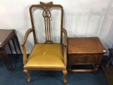 An armchair and a small carved oak chest