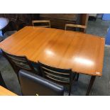 A McIntosh teak extending dining table and four chairs