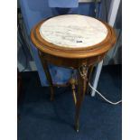 A marble top plant stand, with gilt metal mounts, 41cm diameter, 76cm high