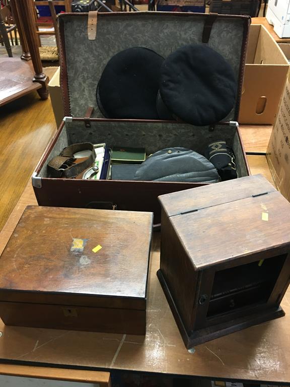 A suitcase containing assorted Naval ephemera and a Bosuns whistle etc.