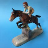 A Beswick figure group girl on a jumping horse