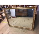 A large gilt framed mirror