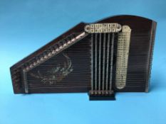 A boxed table harp