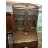 An oak bureau bookcase