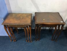 Two walnut nests of tables