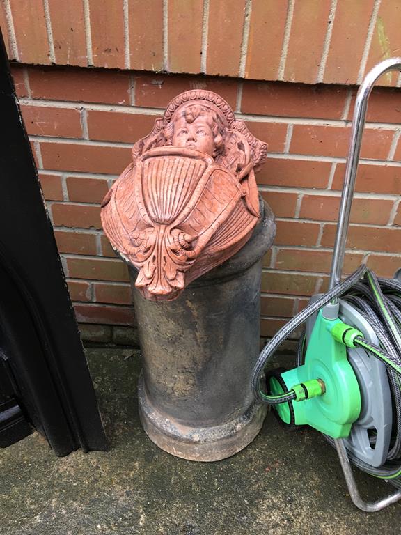 A planter and a chimney pot