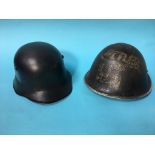 A German style helmet and one other